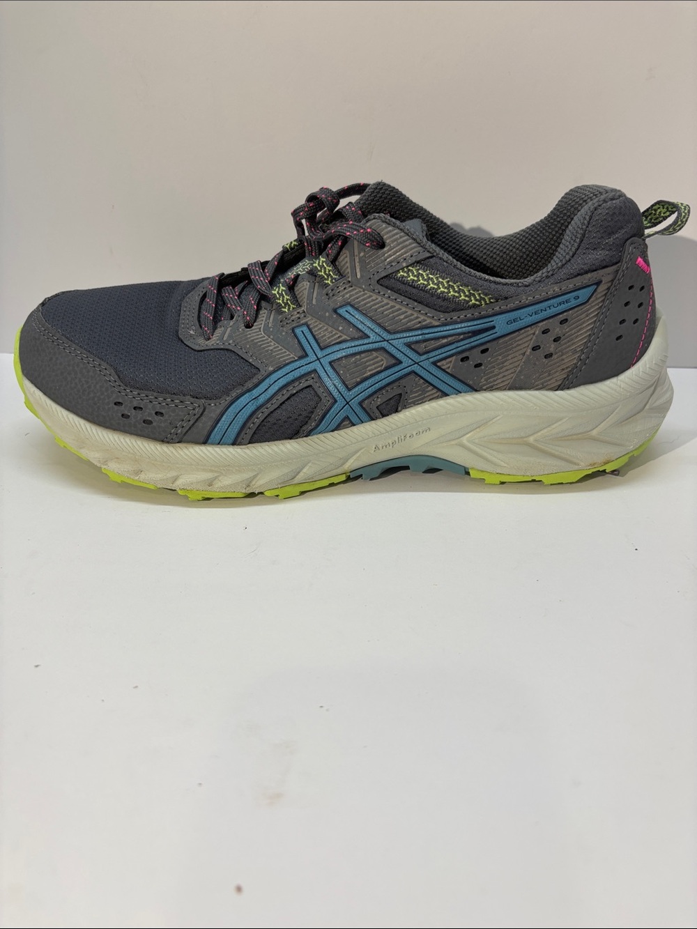 ASICS woman Gray Running Shoe with Blue Logo and Neon Accents  size 9
